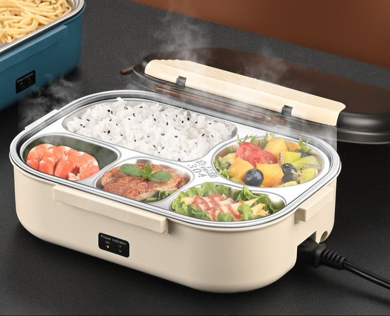 Kreminis maisto indas su keturiomis dalimis, garuojantis, su įvairiais patiekalais.