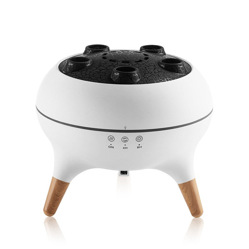 Balta aromaterapijos lempa su juodu viršumi ir medinėmis kojelėmis.