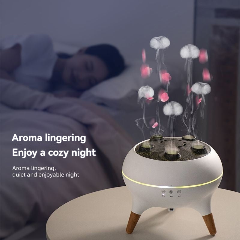 Aromaterapijos difuzorius, apvalus, baltas, su medinėmis kojelėmis ir garais.