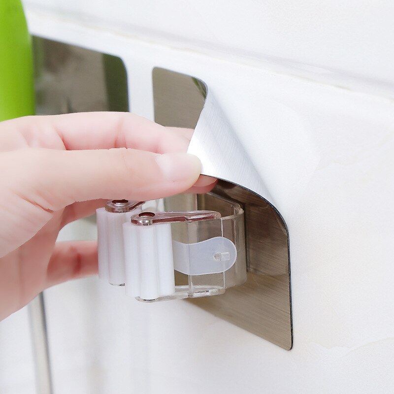 Klijuojami šluotų laikikliai