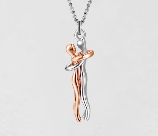 Apsikabinusios poros pakabukas